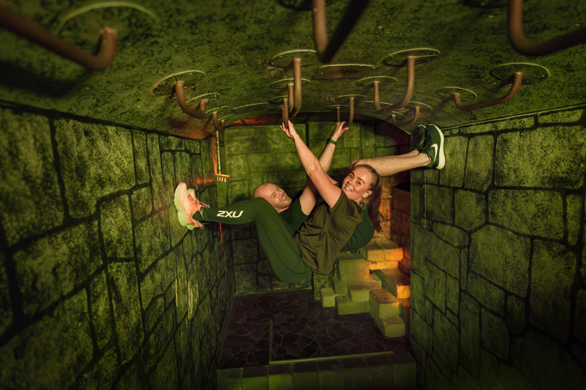 A group climbing on the ceiling