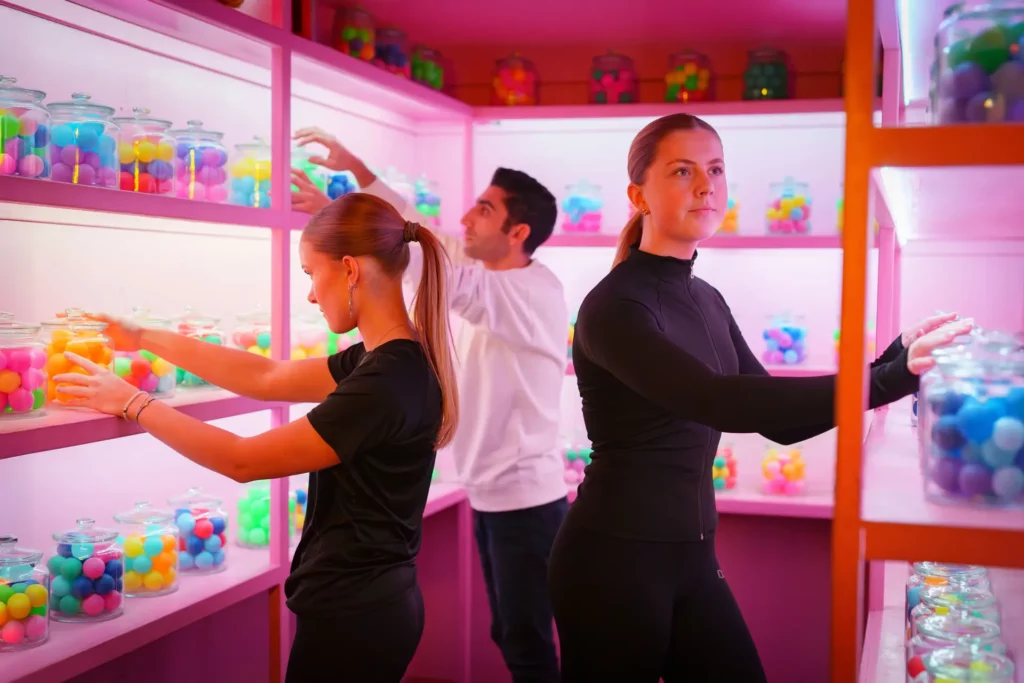 Group with jars of rainbow colored balls
