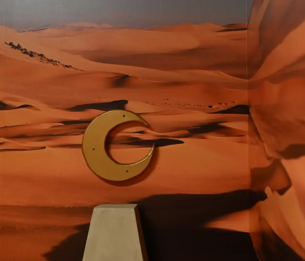 Moon on desert backdrop