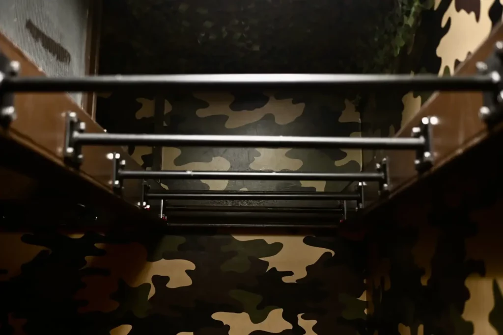 Monkey bars with camouflage wallpaper