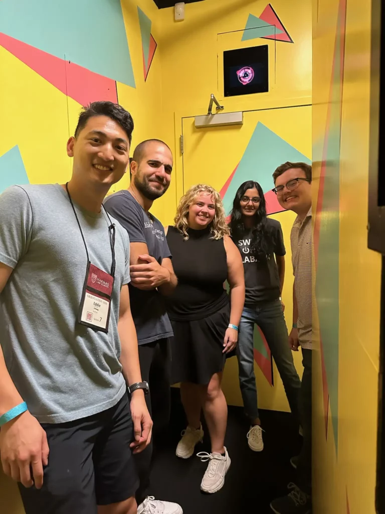 A group of people in a yellow room